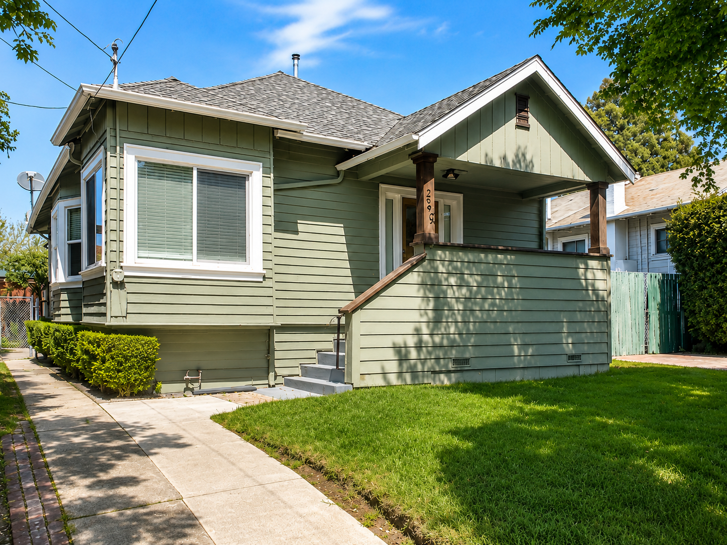 Same bungalow after editing — trash cans removed, porch and address numbers read first.