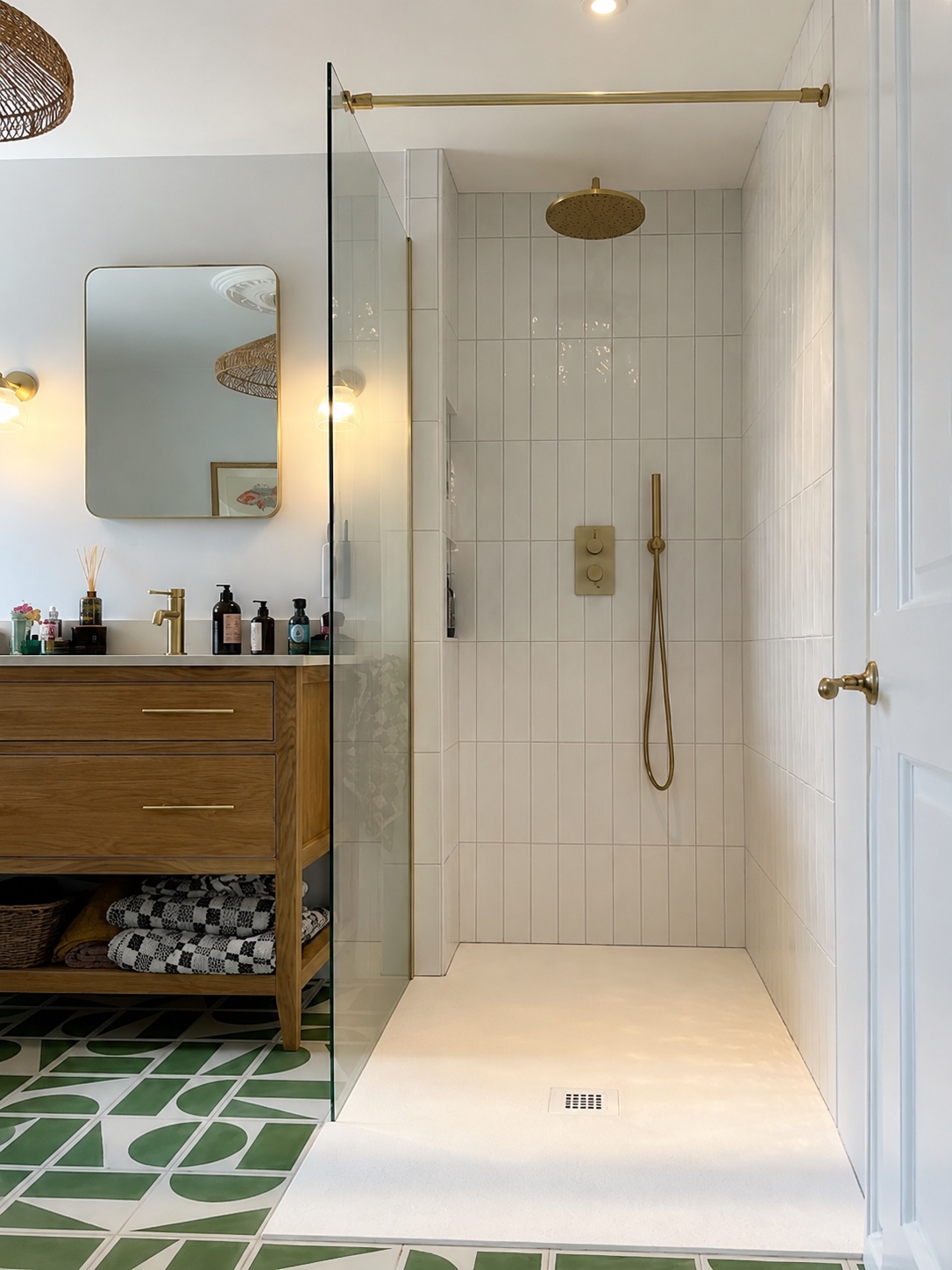 Bathroom before editing — toiletries and soap bottles cluttering the wood vanity counter, mirror reflection busy and distracting, white backsplash detail nearly washing out.
