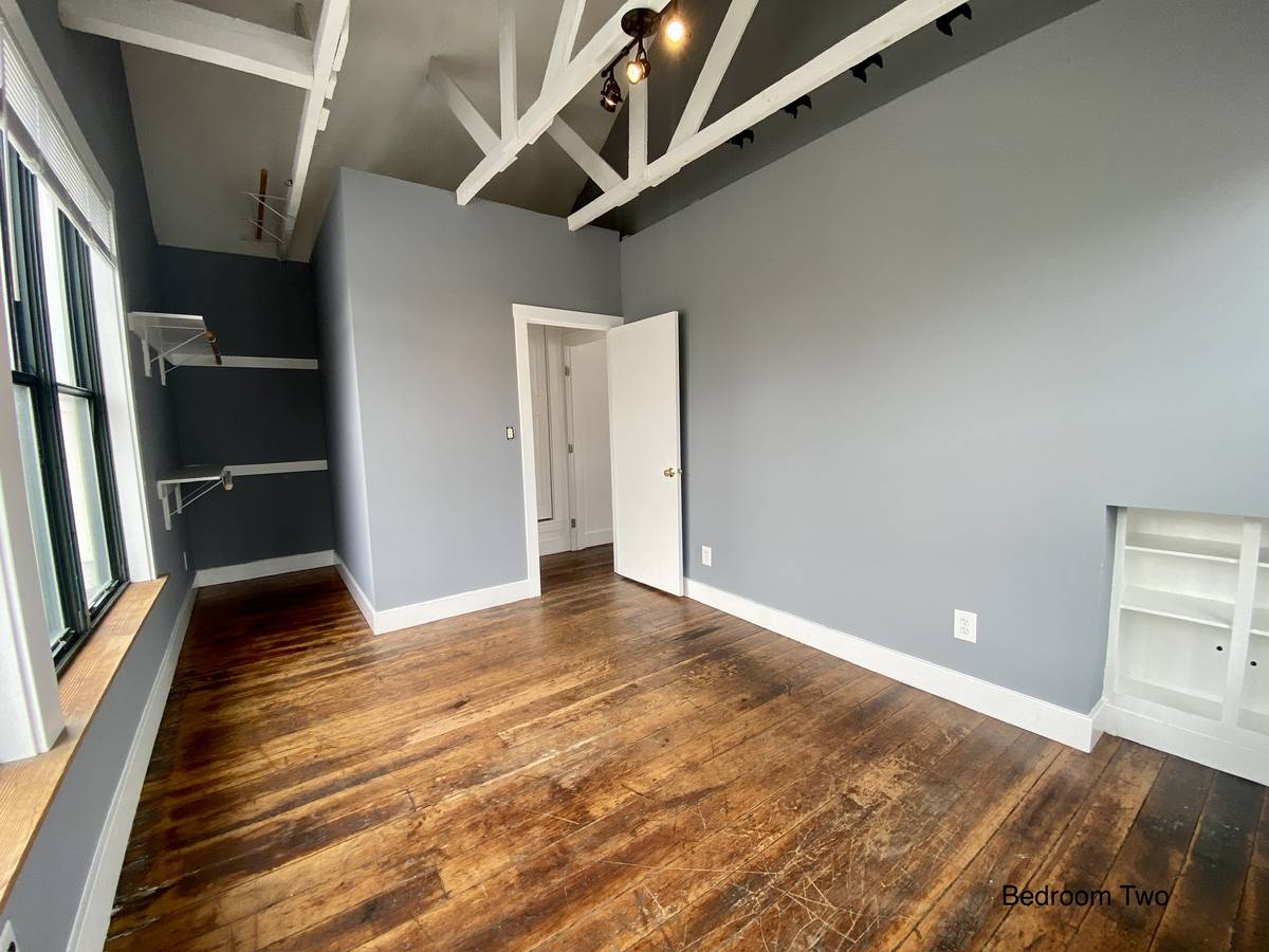 Bedroom Two — vaulted + built-in shelf